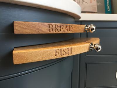 Bespoke engraved wooden cutting boards for bread and fish